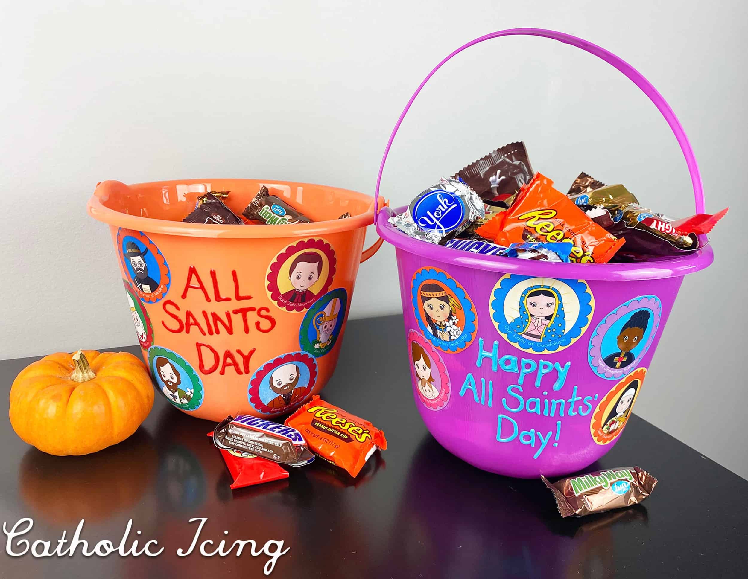 Treat buckets for All Saints' Day with saint stickers.